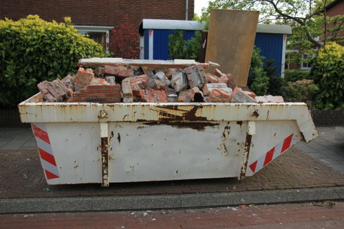 A professional team carrying out hoarder clearance in a London home
