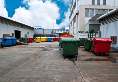 Workers loading mixed junk and bulky items for disposal in London