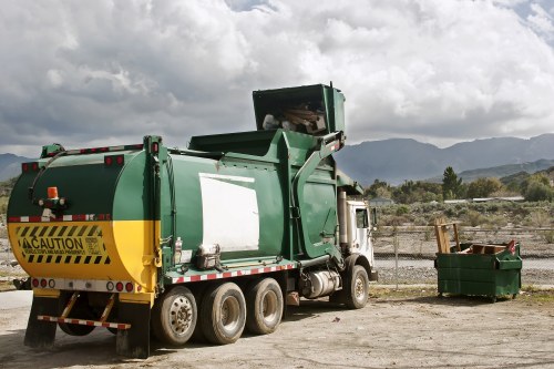 Professional hauling crew loading unwanted items onto a truck