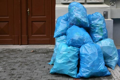 London bulky waste collection with heavy items being loaded for disposal