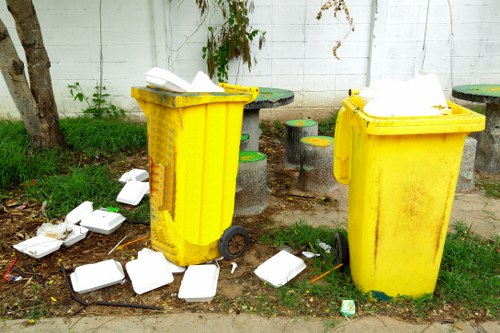 Workers preparing a property for junk hauling and removal