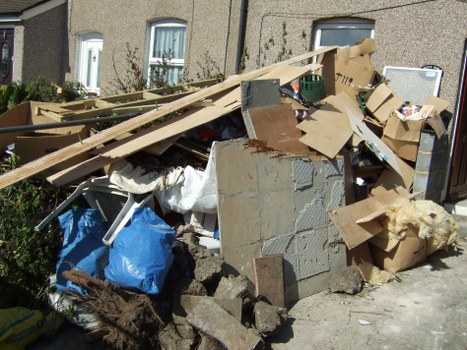 Professional team handling a flat clearance with careful access planning